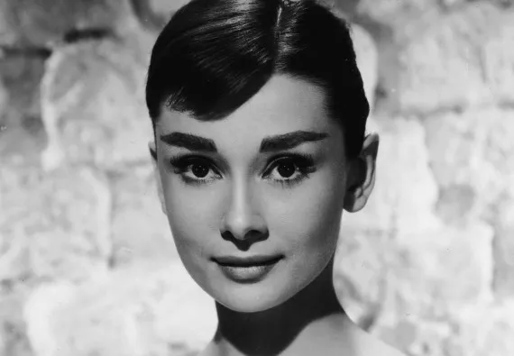 Portrait of Belgian-born American actress Audrey Hepburn (1929 - 1993) ina white long-sleeved dress, mid 1950s. (Photo by /Getty Images)